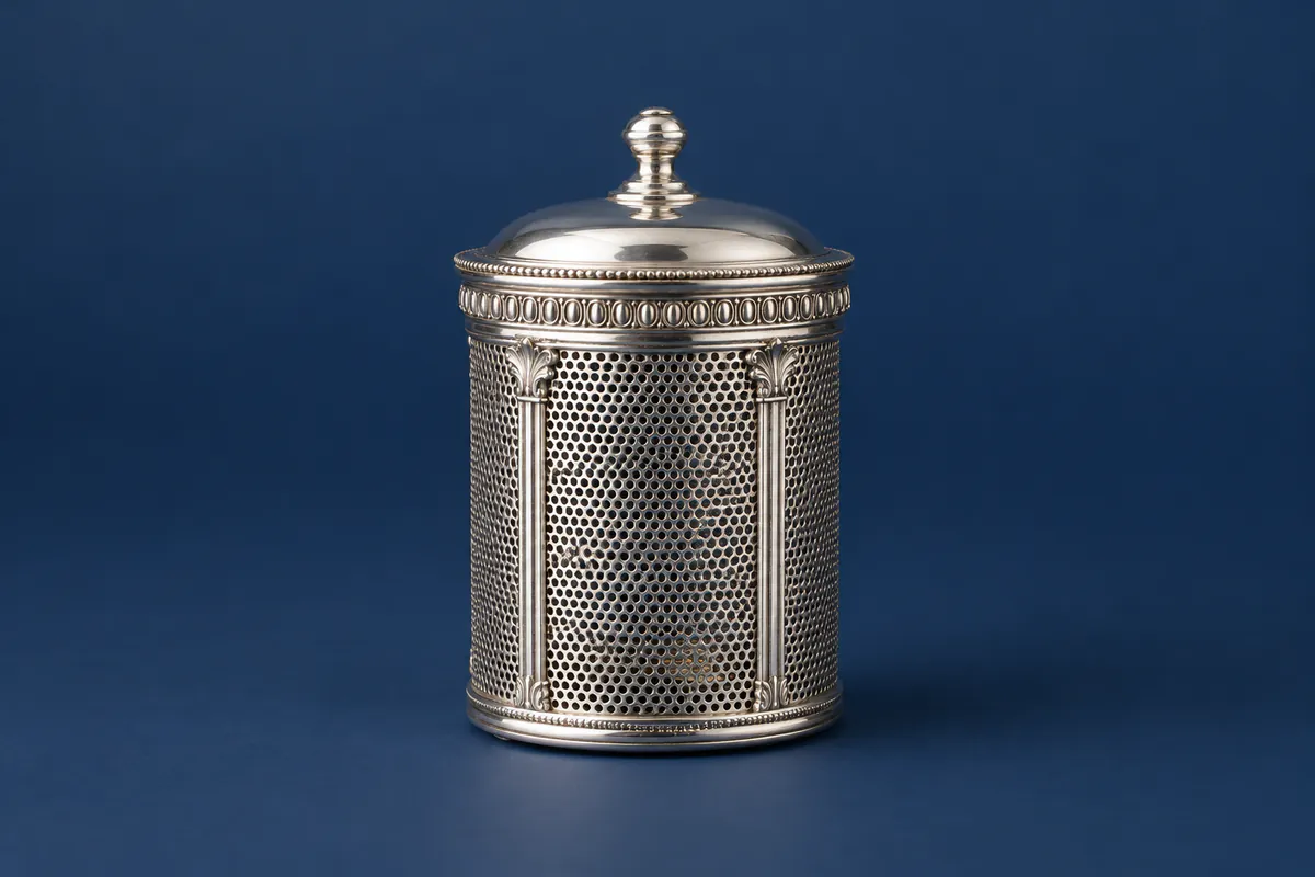 Lidded silver tea infuser with fine metal mesh