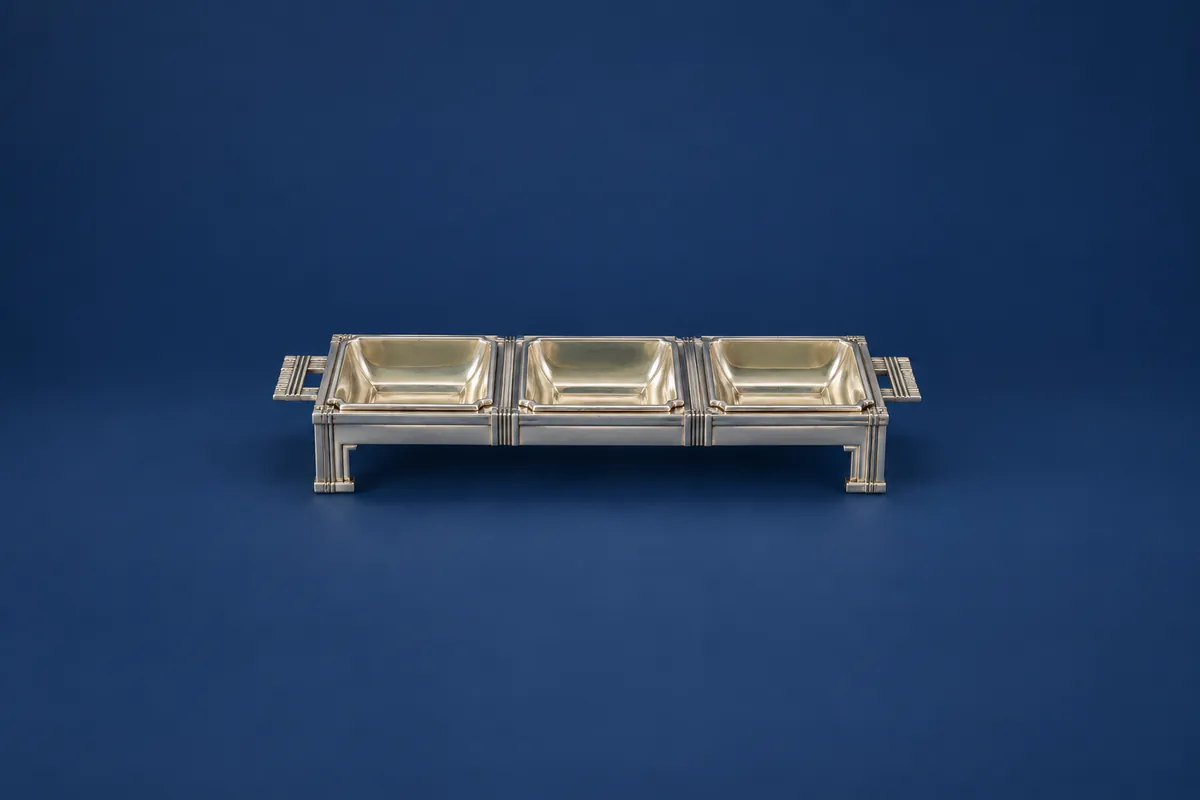 Silver serving dish with three separate inset compartments
